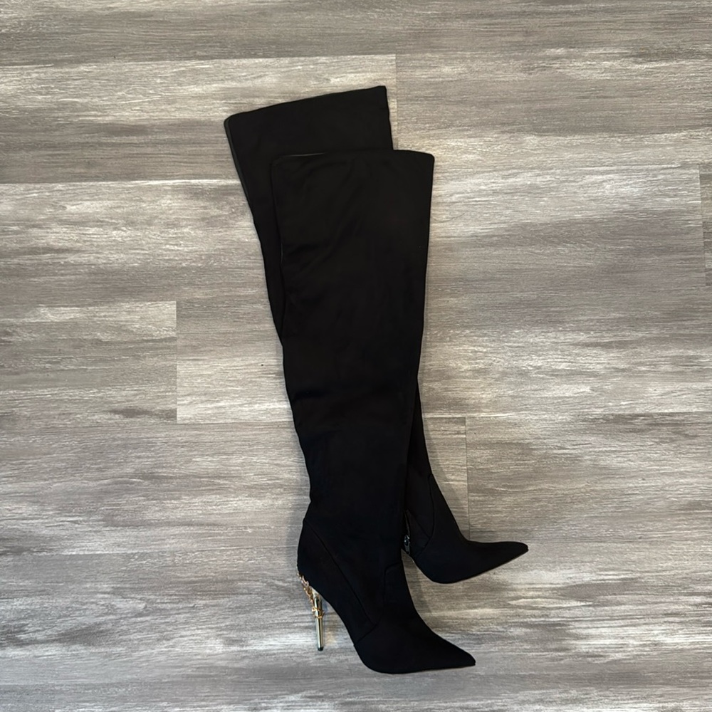 Over the knee black boots with pointed toe and gold decorative stiletto heel